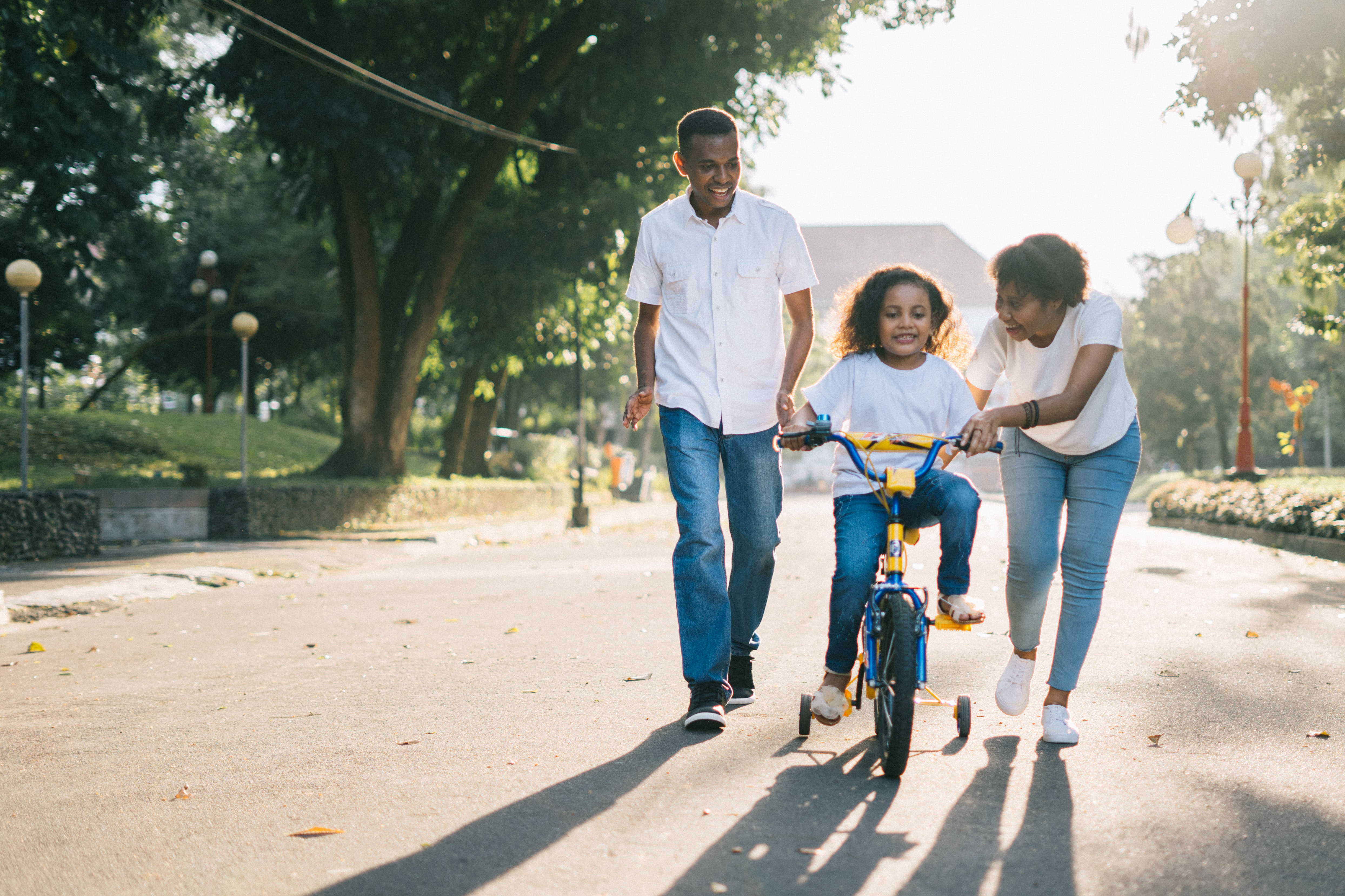 Couple with kid rinding a bike